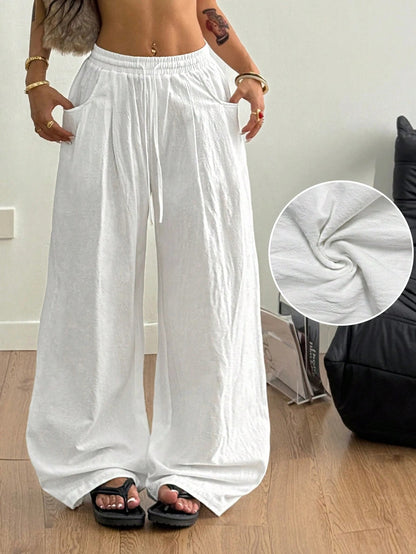 Wide-Leg Trousers in White Crinkle Cotton - white front view with drape detail