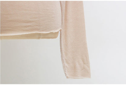 Top in Sheer Stretch Mesh with Turtleneck and Long Sleeves - apricot sleeve and hem close-up