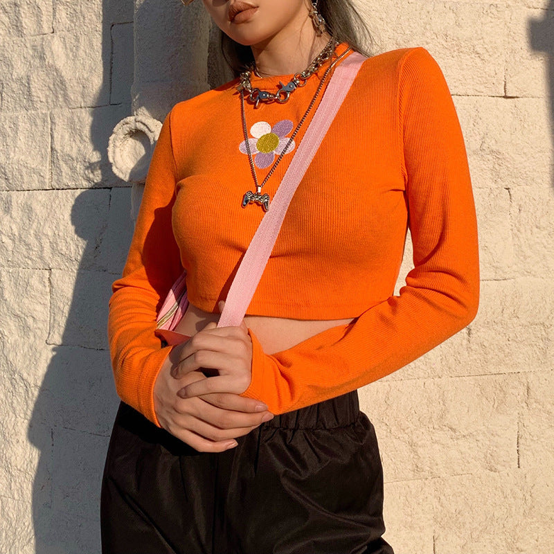 Crop Top in Orange Ribbed Knit with Daisy Applique - orange front three-quarter outfit view