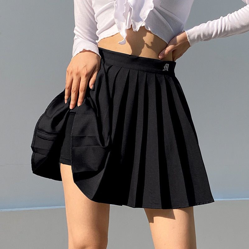 Mini Skirt in Pleated A-Line with Elastic Waist - black front lifestyle view