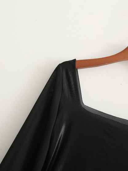 Bodysuit in Black Faux Leather with Sheer Sleeves - black shoulder seam close-up