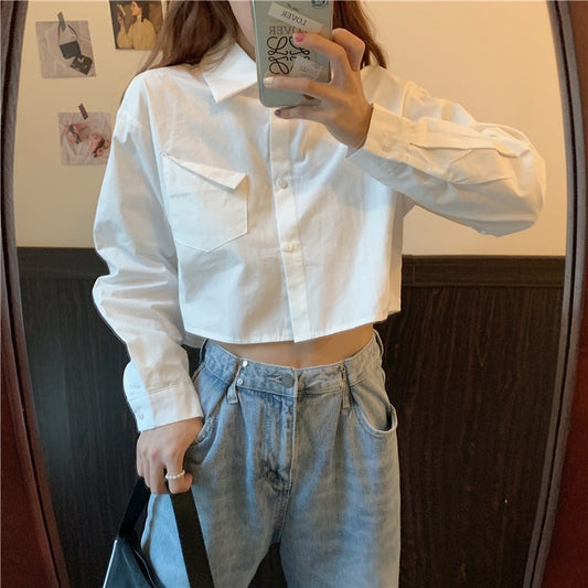 Shirt in White with Cropped Boxy Fit - white front view styled with grey trousers