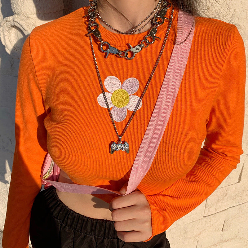 Crop Top in Orange Ribbed Knit with Daisy Applique - orange fitted front close-up