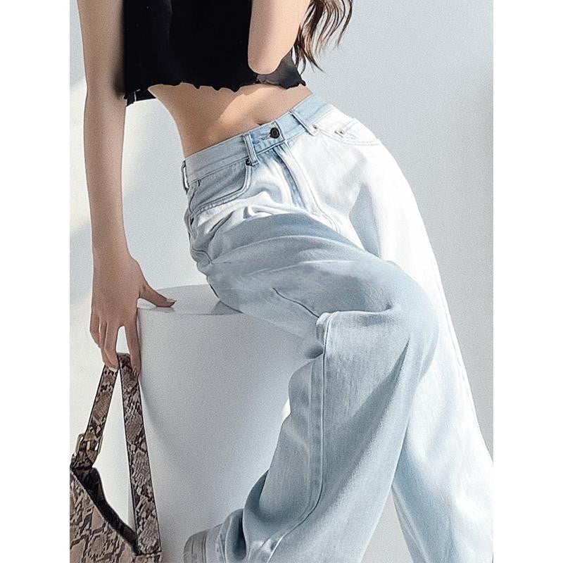 Jeans in Light Blue High-Waist Wide-Leg Denim - seated side drape detail