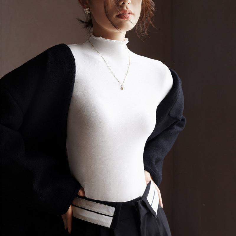 Top in Stretch Mock Neck with Ruffle Trim - white styled with black jacket