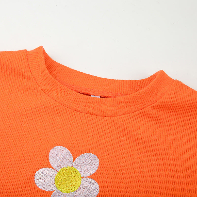 Crop Top in Orange Ribbed Knit with Daisy Applique - orange crew neckline close-up