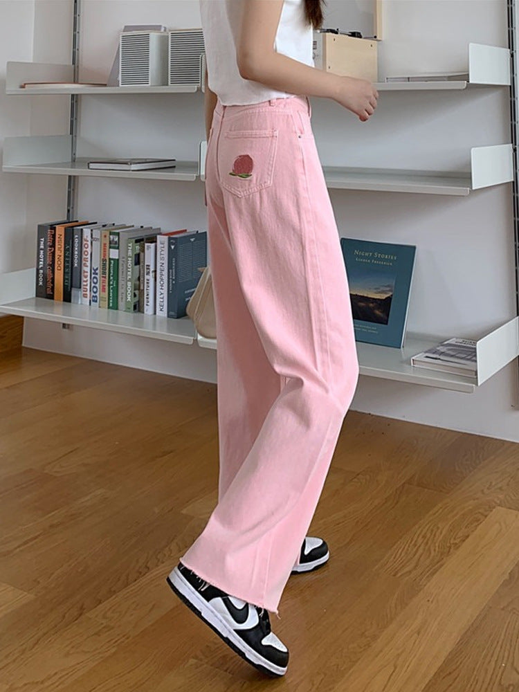 Trousers in Blush Pink High-Rise Wide-Leg Denim - blush pink side view