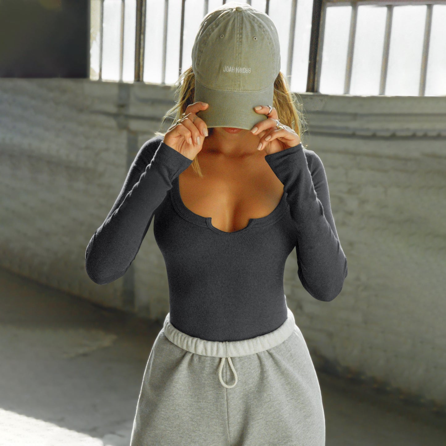 Long-Sleeve Top with Heart Notch Neckline - dark grey front view with cap