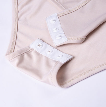 Bodysuit with Asymmetric One-Shoulder Long Sleeve - apricot close-up of popper gusset fastening