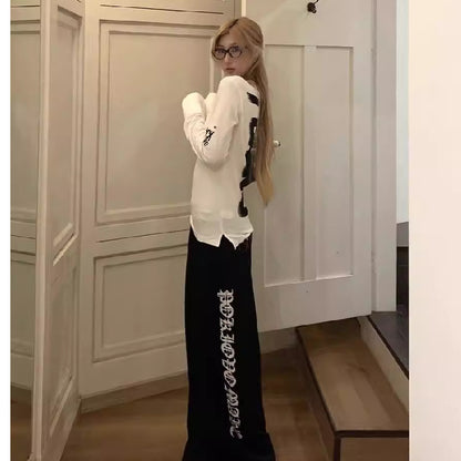 Long-Sleeve Top in White with Open-Back Graphic - white side profile styled look