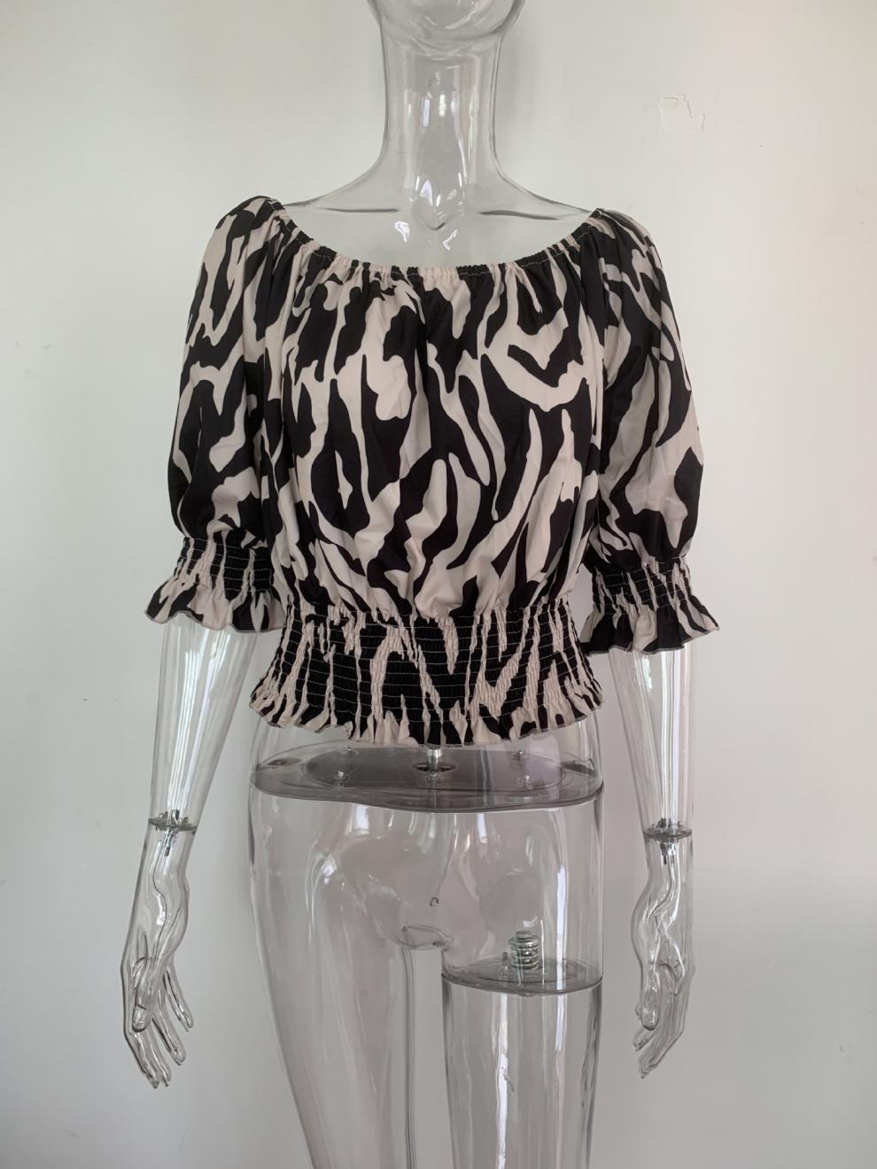Blouse in Abstract Animal Print with Bardot Neckline - black mannequin front