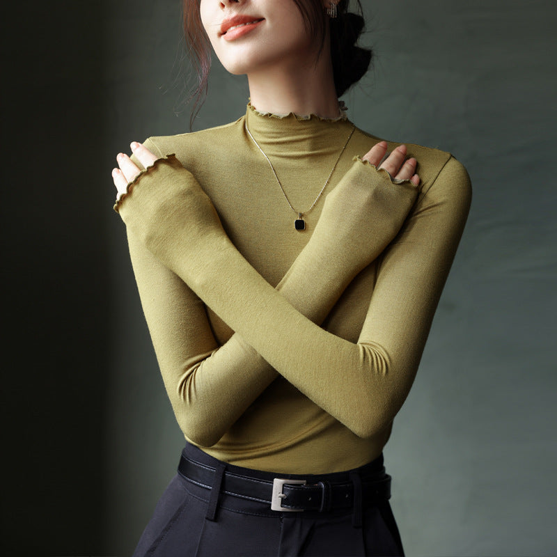 Top in Stretch Mock Neck with Ruffle Trim - mustard yellow cross-arm view