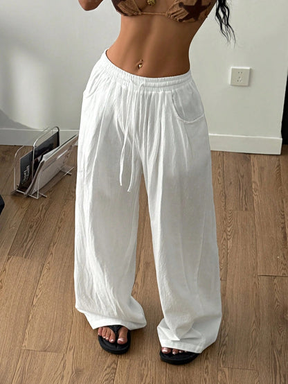 Wide-Leg Trousers in White Crinkle Cotton - white front angle view