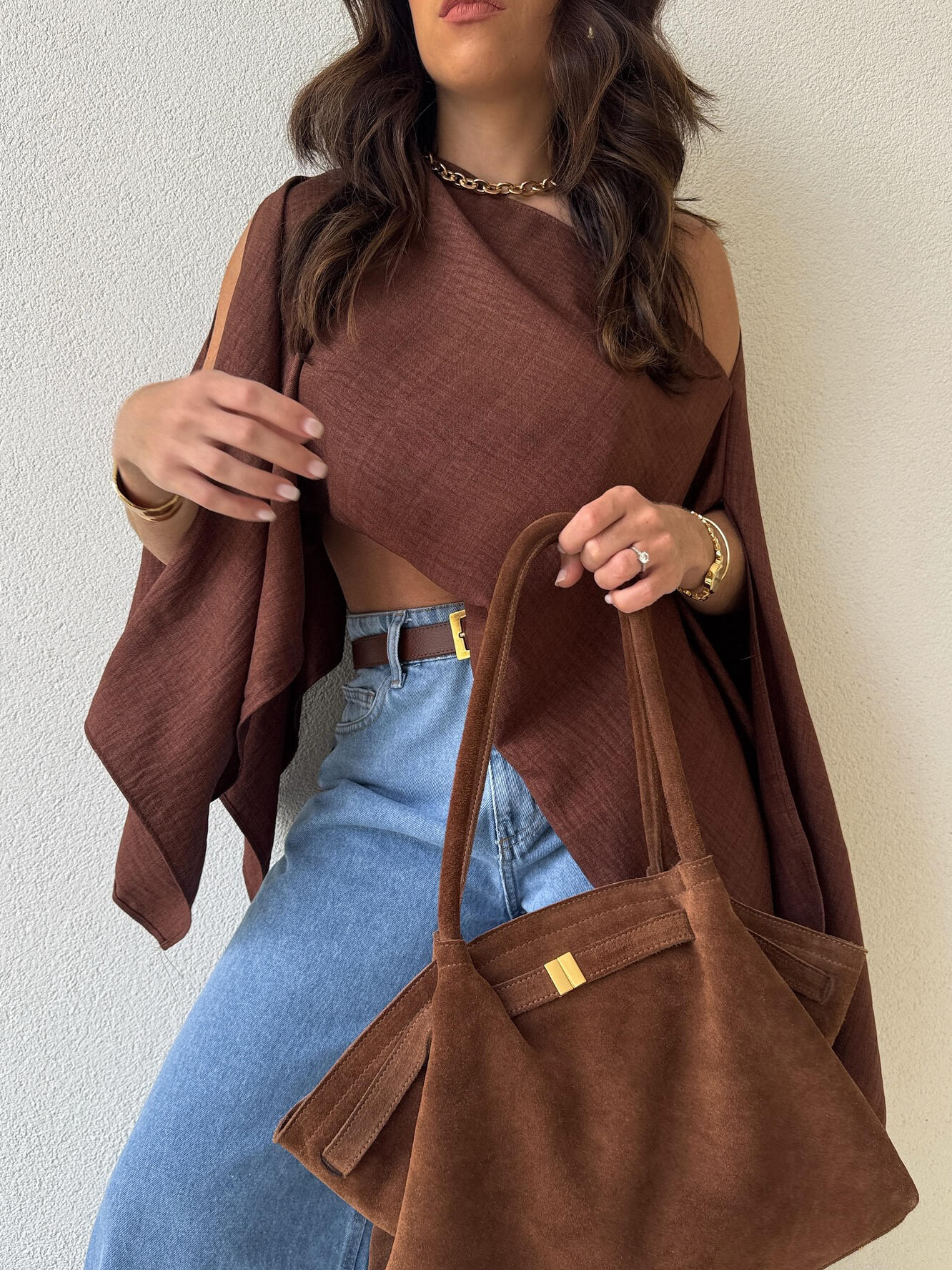 Brown Asymmetric One-Shoulder Drape Top — close-up of the asymmetric drape with brown tote bag