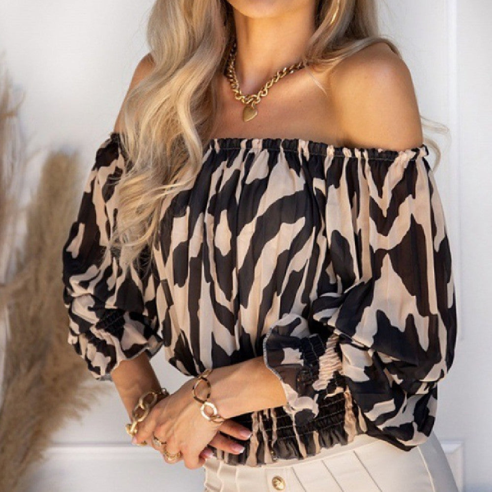 Blouse in Abstract Animal Print with Bardot Neckline - black front close-up