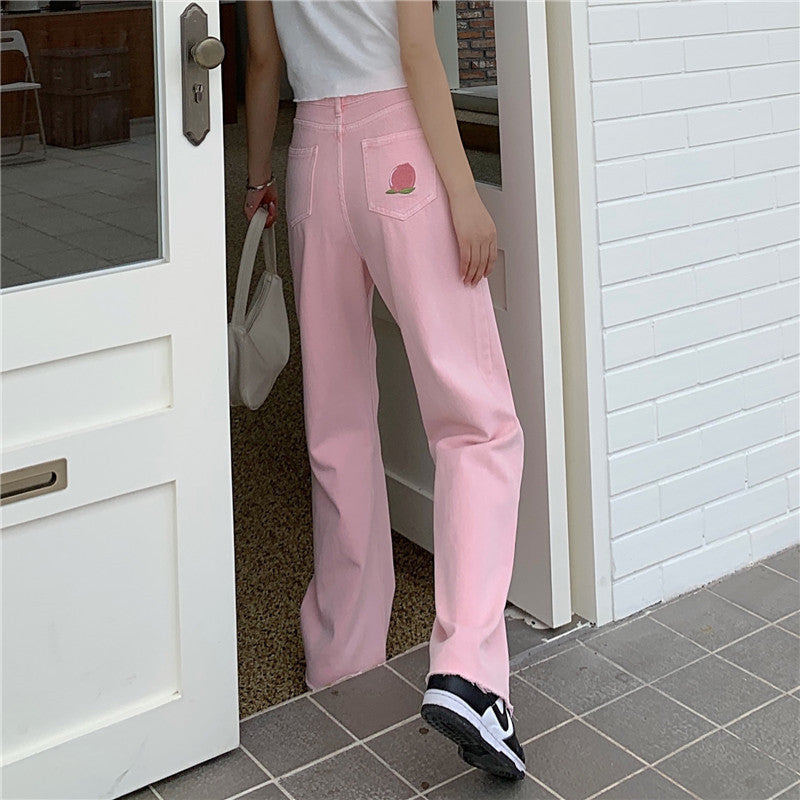 Trousers in Blush Pink High-Rise Wide-Leg Denim - blush pink back and side view