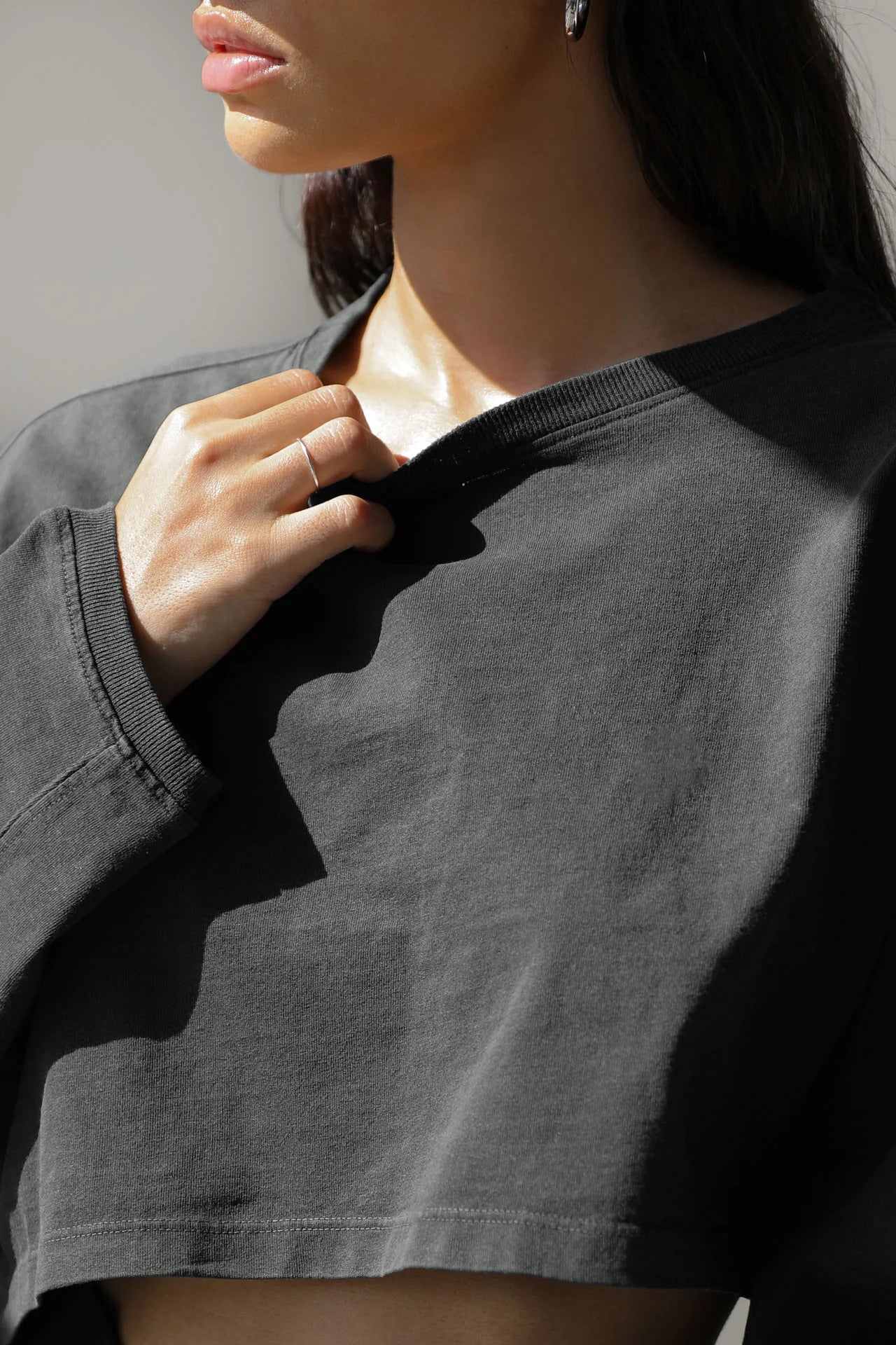 Crop Sweatshirt with Balloon Sleeves in Washed Neutrals - dark grey close-up of neckline and washed finish