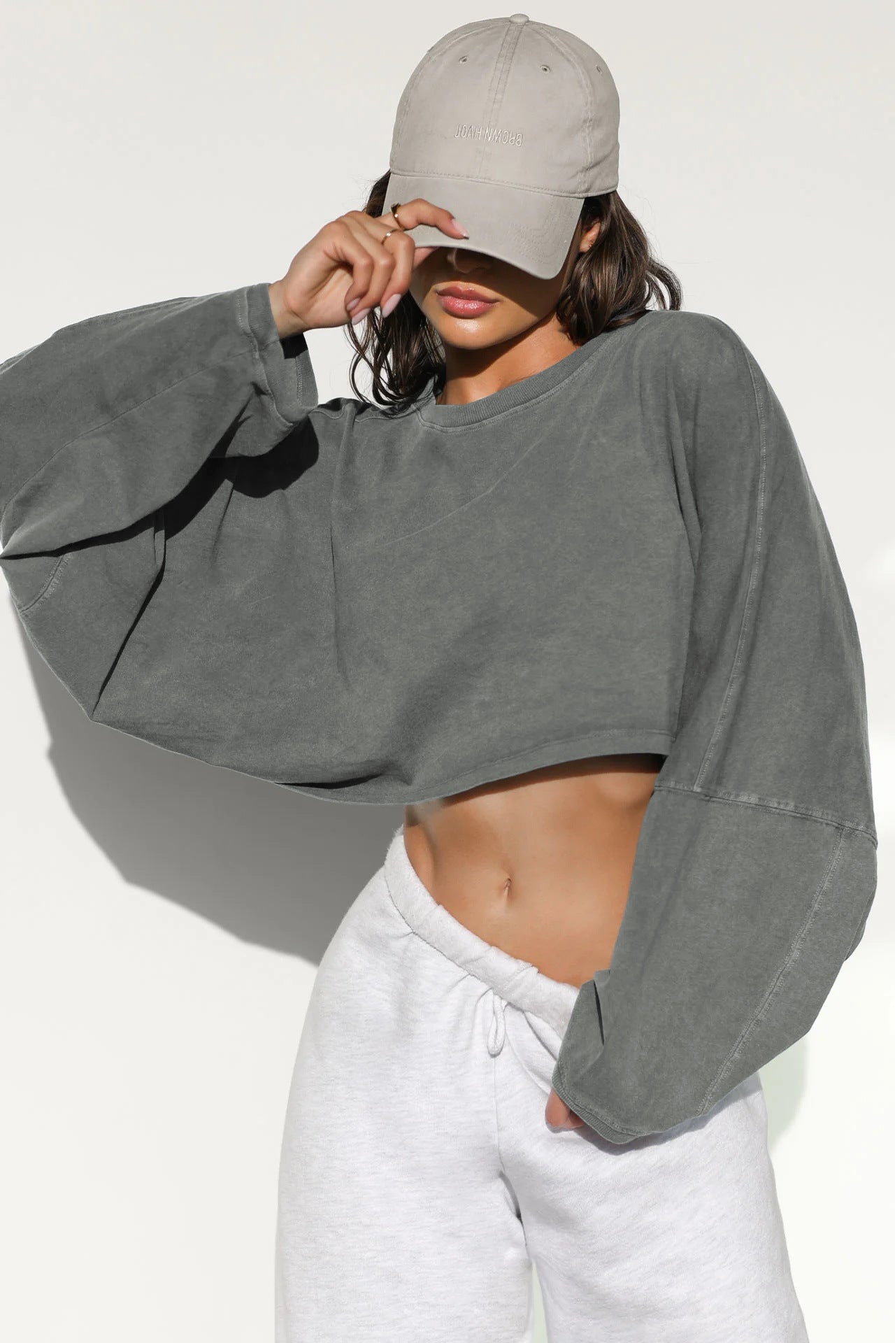 Crop Sweatshirt with Balloon Sleeves in Washed Neutrals - dark grey off-shoulder front view