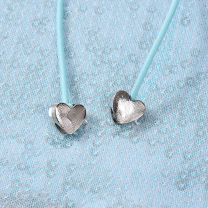 Sleeveless Top in Mint Green & Black with Sequin Cut-Out and Beaded Tie - mint green heart bead tie close-up