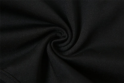 Bodysuit in Black with Open Back and Front Cut-Outs - black fabric texture