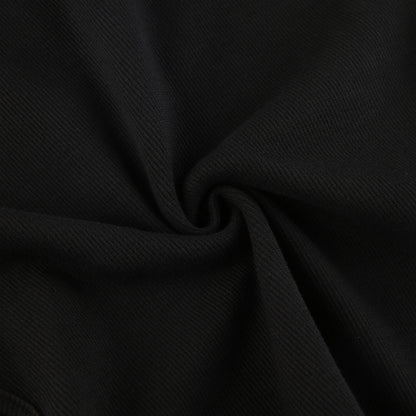 Bodysuit in Black with Shoulder Cut-Outs & Arm Warmers - black ribbed fabric close-up