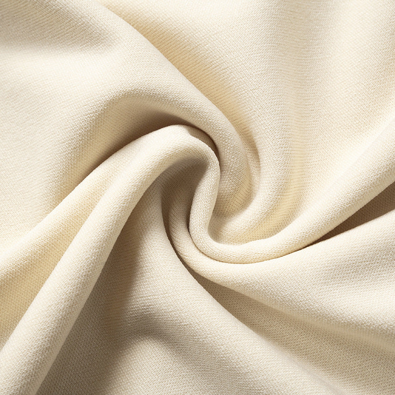 Mini Dress with One-Shoulder Twist Detail - Light Apricot fabric texture close-up