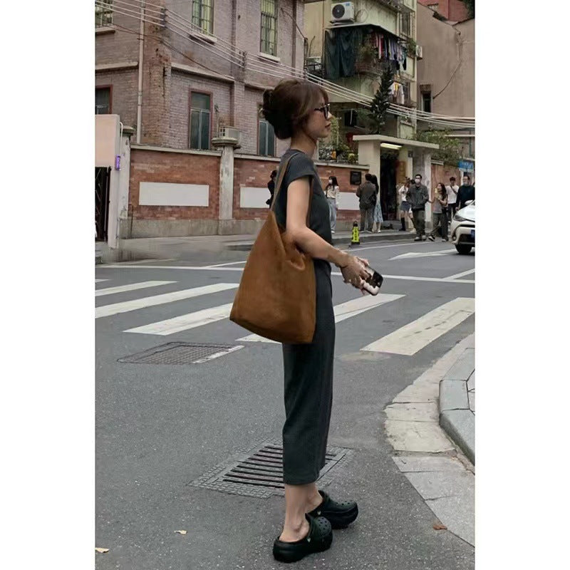 Maxi Dress in Charcoal Cotton Jersey - profile view with tote styling