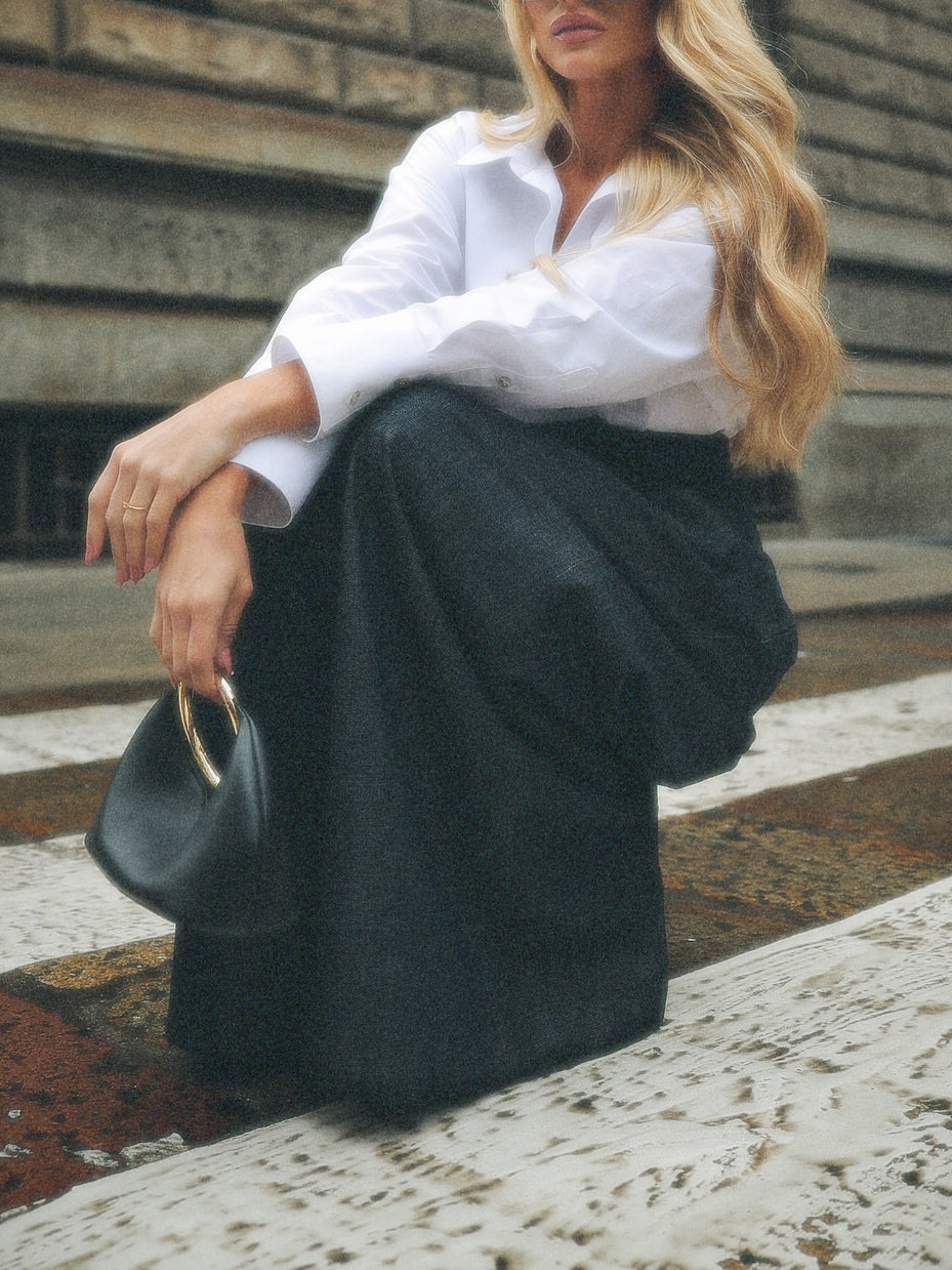 Dark-Wash High-Waist Wide-Leg Jeans - styled with white shirt, seated pose