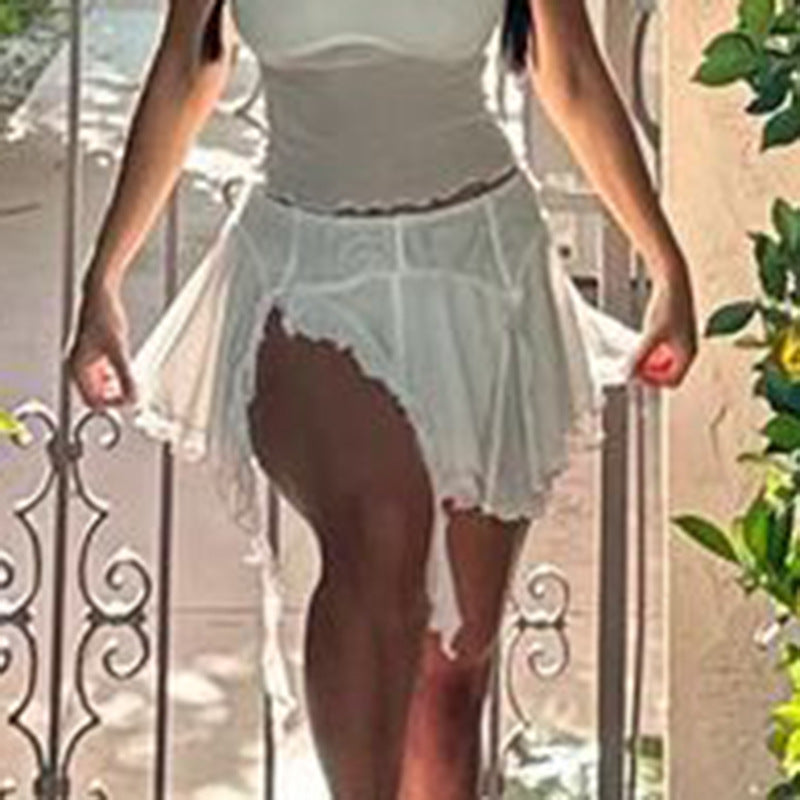 Mini Skirt in White with Pleated Mesh Overlay - movement detail at split front