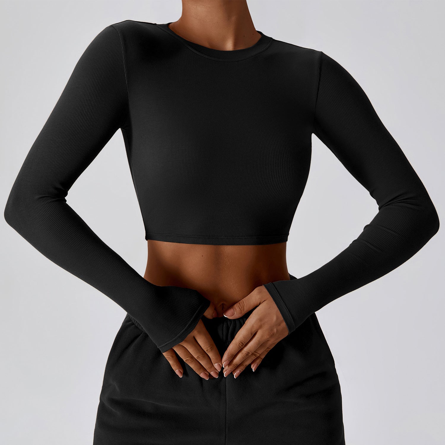 Crop Top with Thumbhole Cuffs in Quick-Dry Stretch - Premium Black front view
